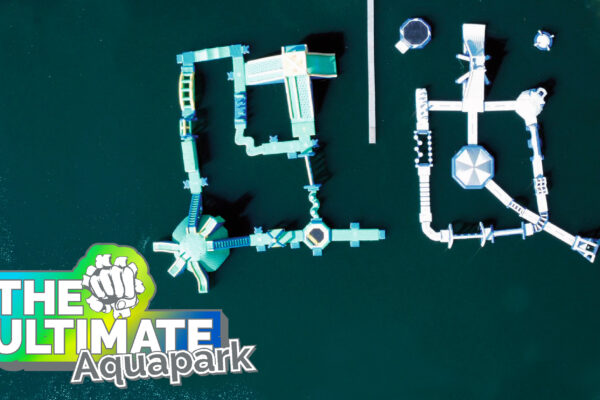 Wipeout and warrior inflatable aquapark layout on a lake with The Ultimate logo overlaid on top